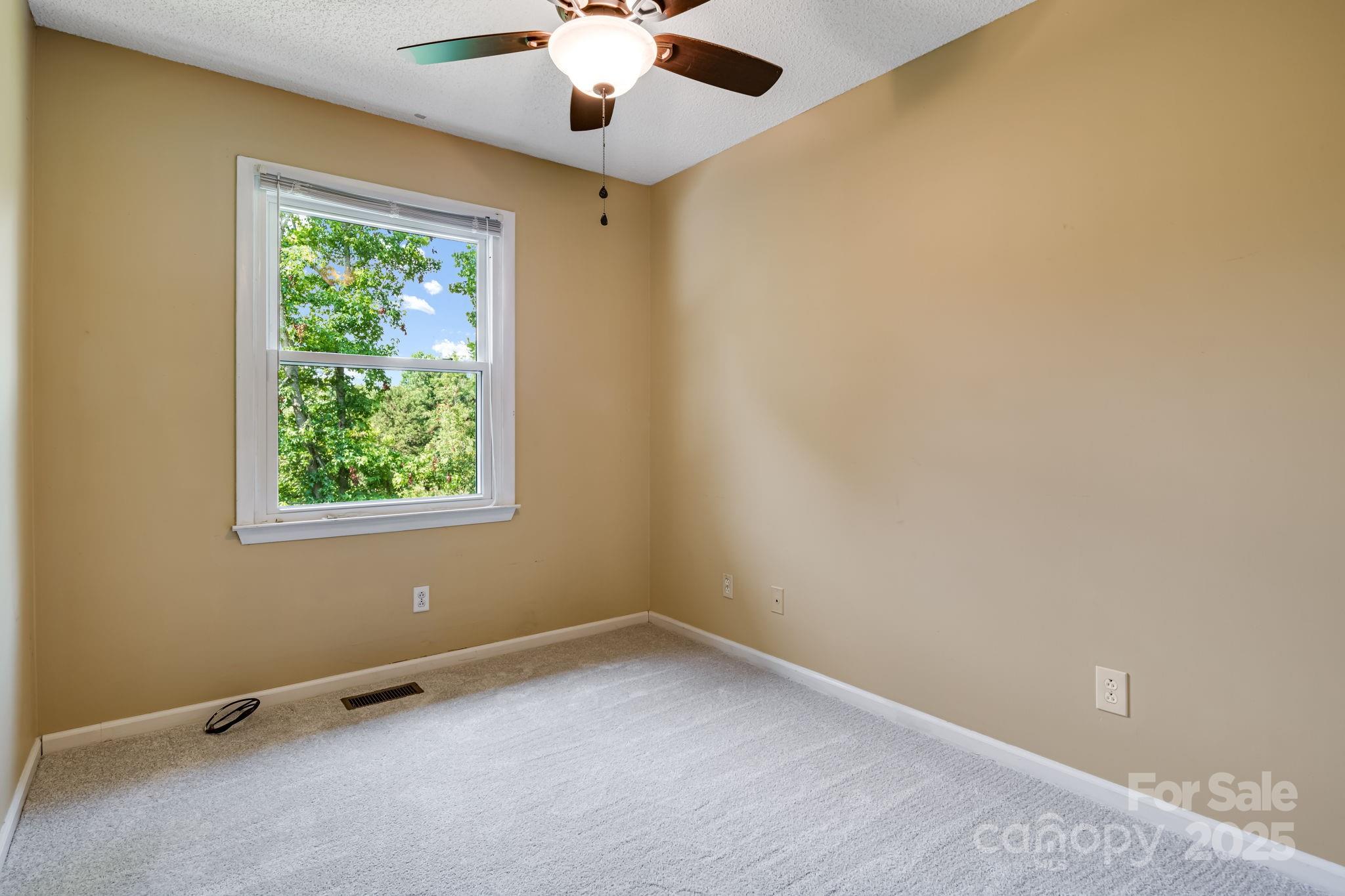1360 Jupiter Road Weaverville, NC 28787 - Photo 8 of 39 an empty room with a window