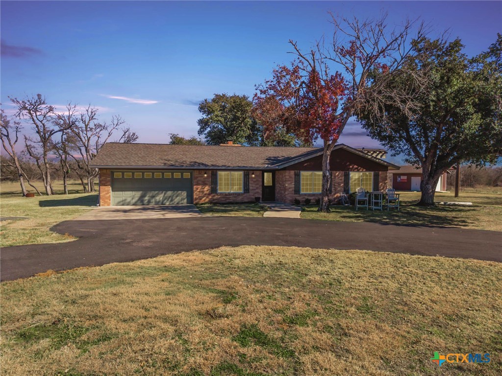 2443 Highway 36 Cameron, TX 76520 - Photo 2 of 34 a front view of a house with a yard