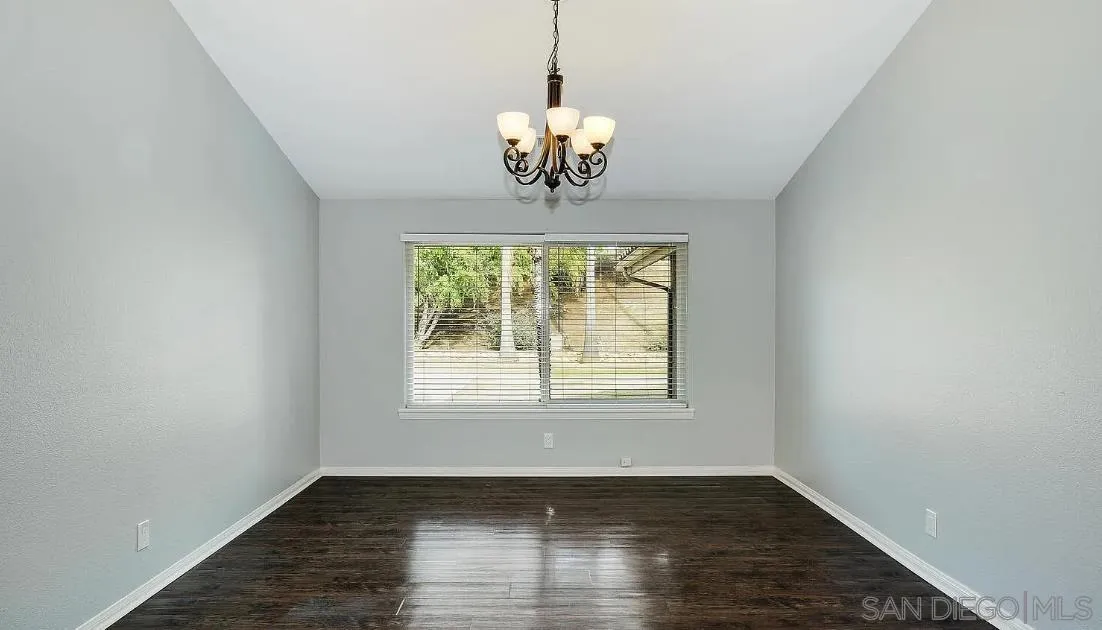 14525 Millards Ranch Lane Poway, CA 92064 - Photo 13 of 29 a view of an empty room with wooden floor and a window