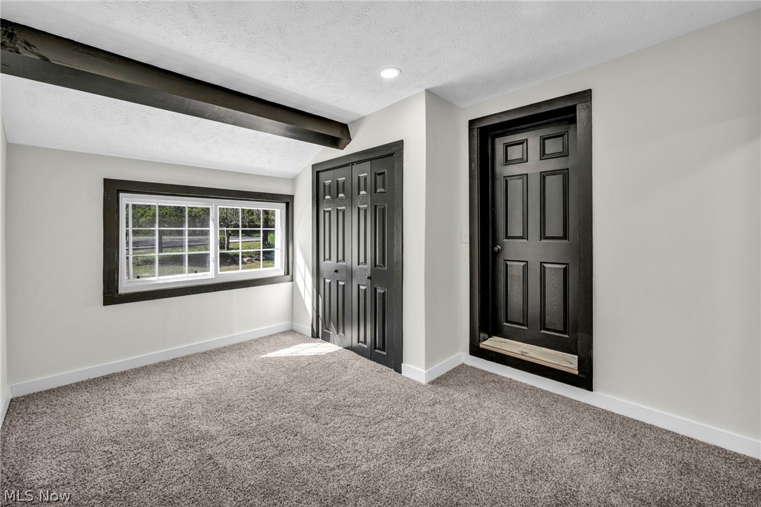 7339 River Road Olmsted Falls, OH 44138 - Photo 23 of 45 Room featuring neutral wall paint and plush carpet flooring