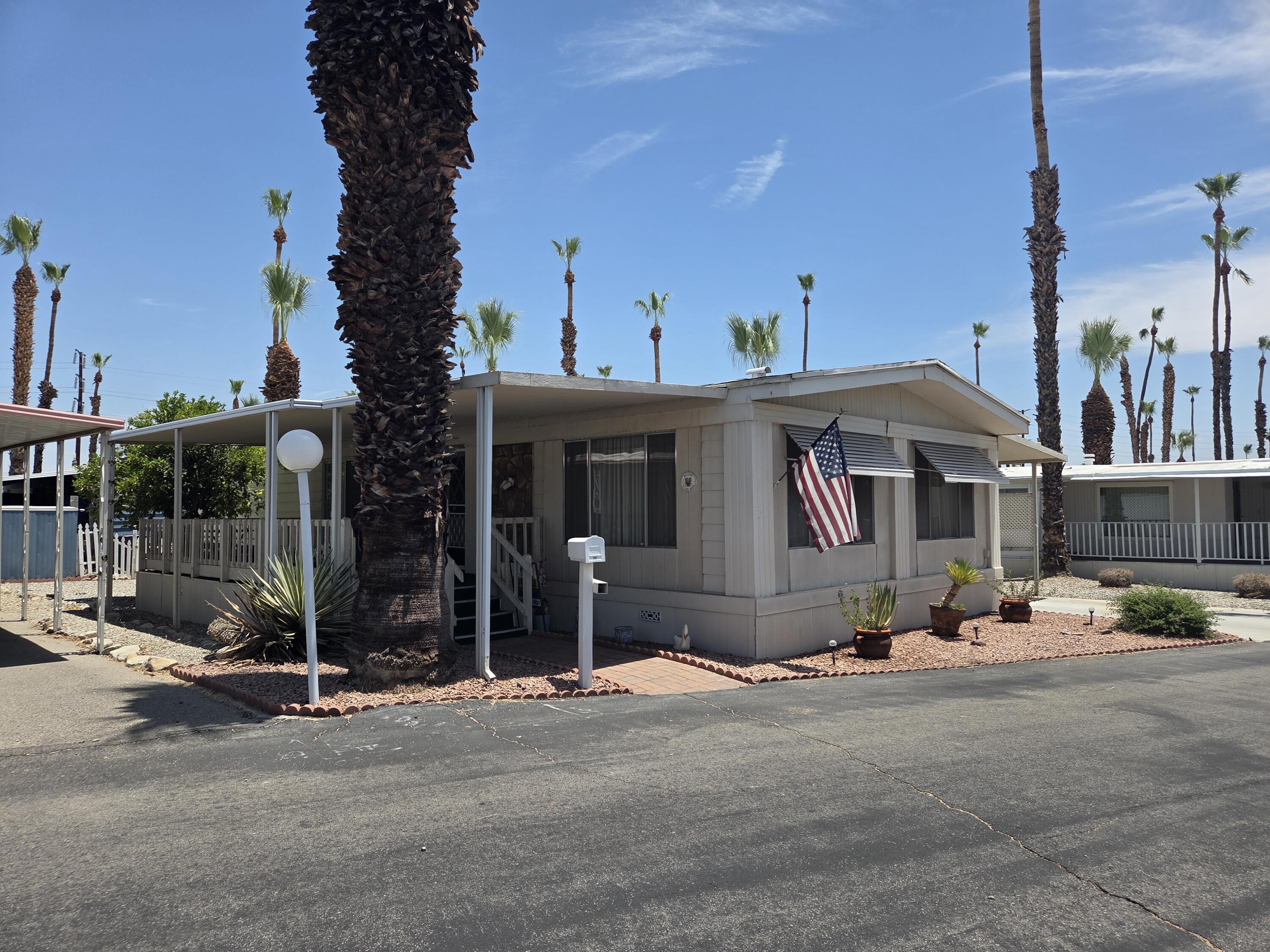 a front view of a house with basket ball court