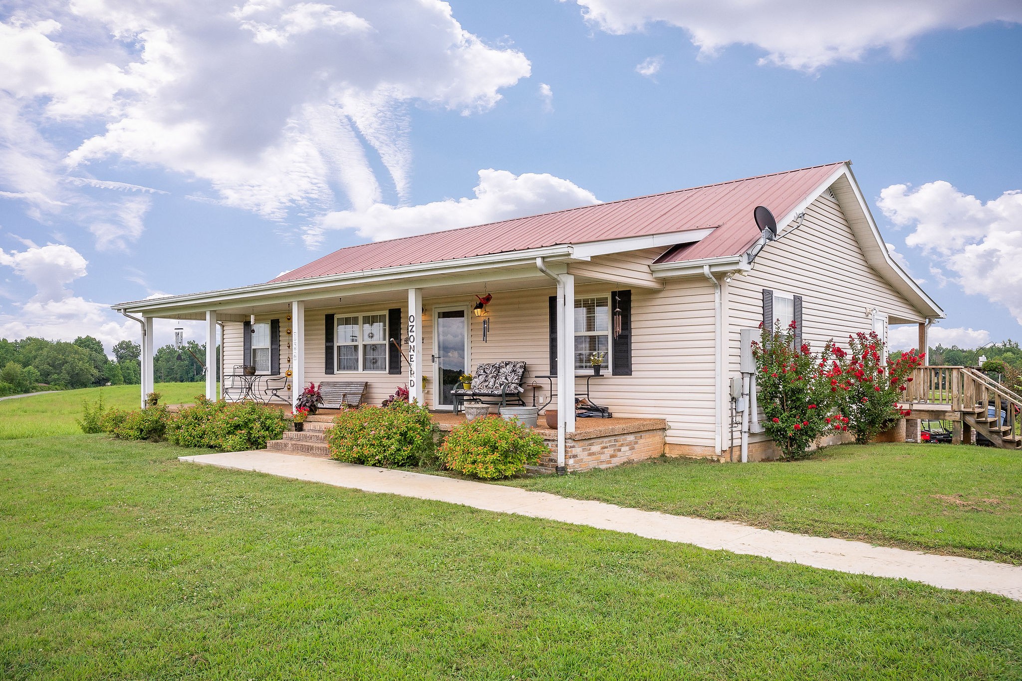 a front view of house with yard and green space