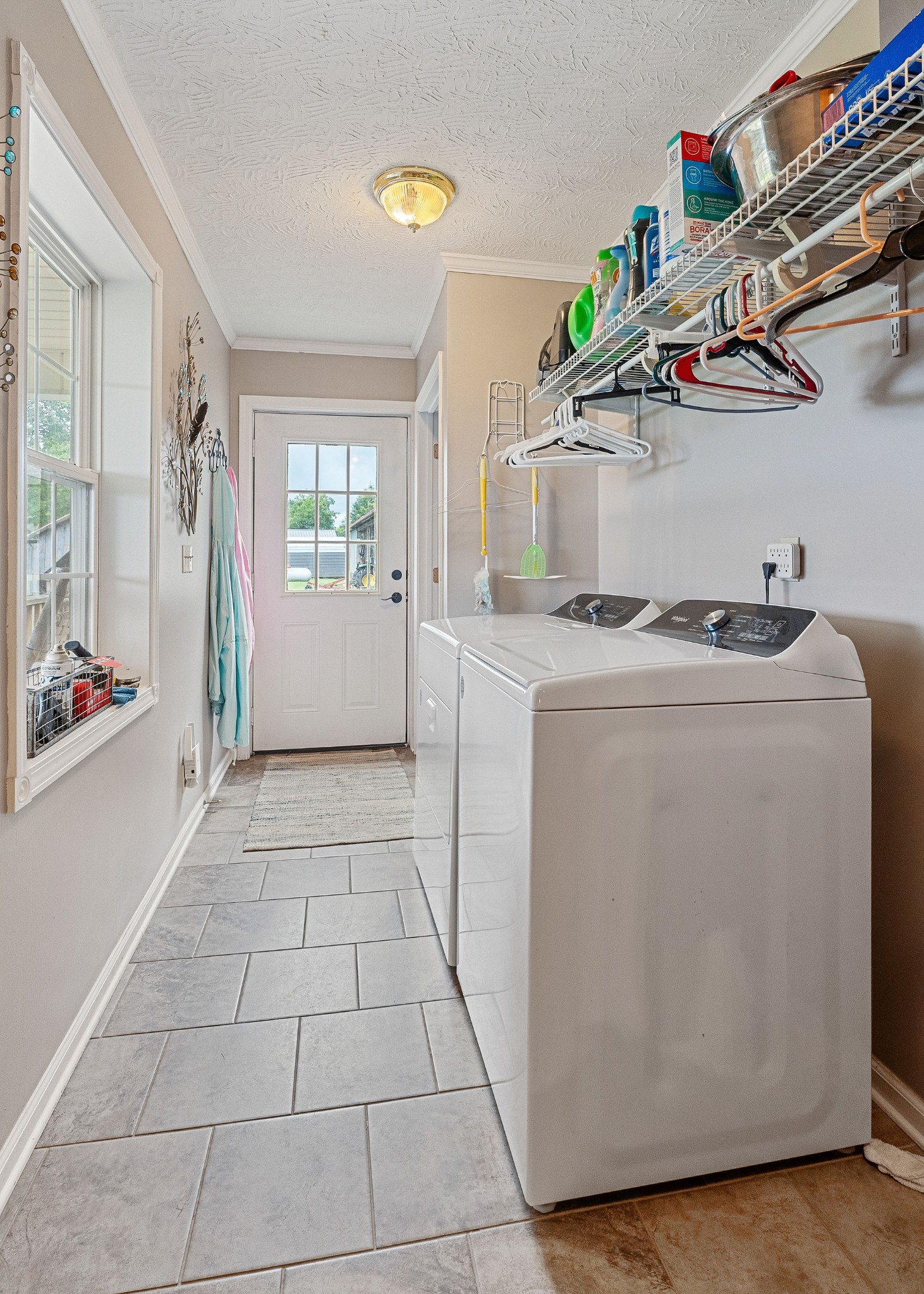 126 Ozone Road Monroe, TN 38573 - Photo 23 of 40 a utility room with cabinets dryer and washer