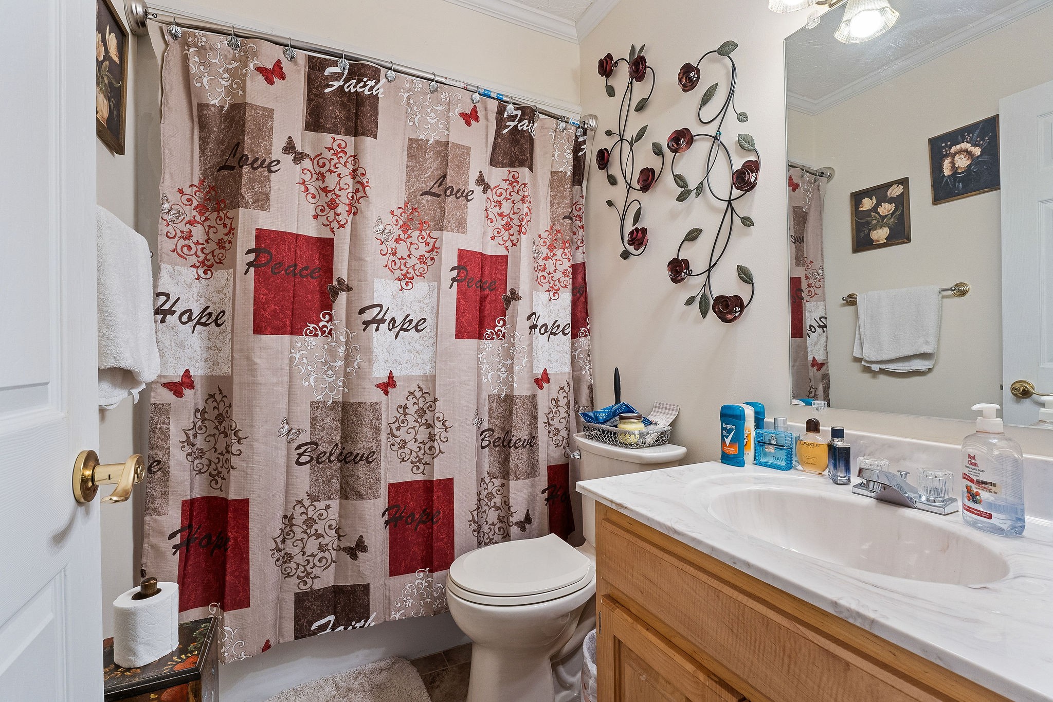 126 Ozone Road Monroe, TN 38573 - Photo 24 of 40 a bathroom with a sink toilet and shower curtain