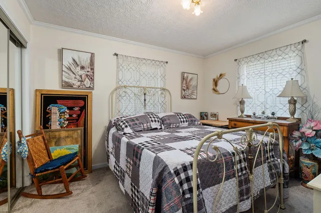 a bedroom with a bed and a mirror