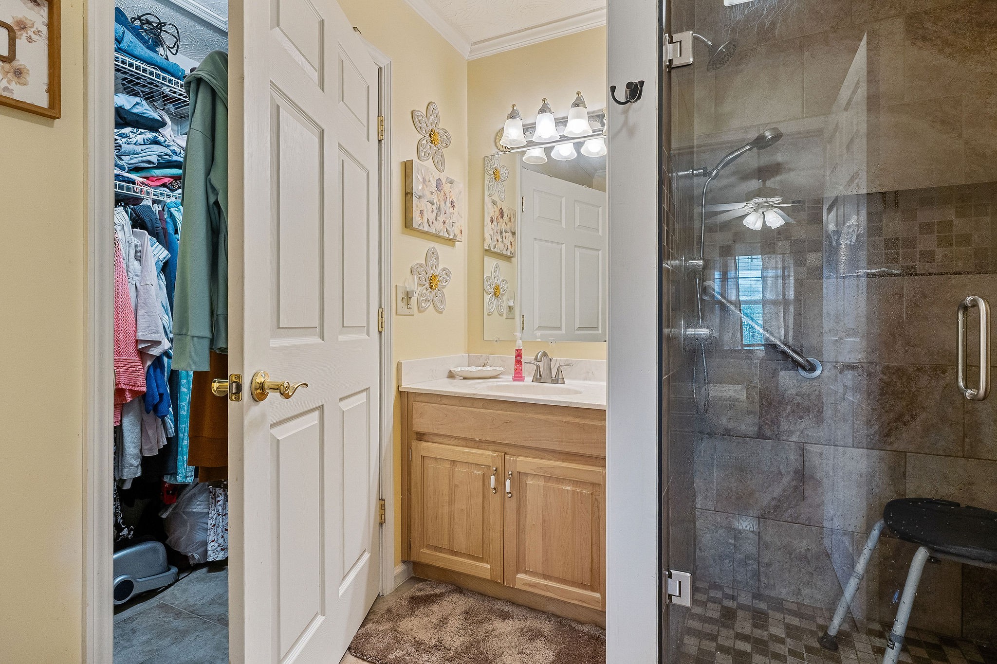 126 Ozone Road Monroe, TN 38573 - Photo 32 of 40 a bathroom with a double vanity sink a toilet and shower