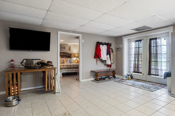 a bedroom with a bed and a mirror