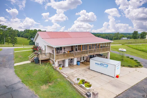 a view of a house with a big yard
