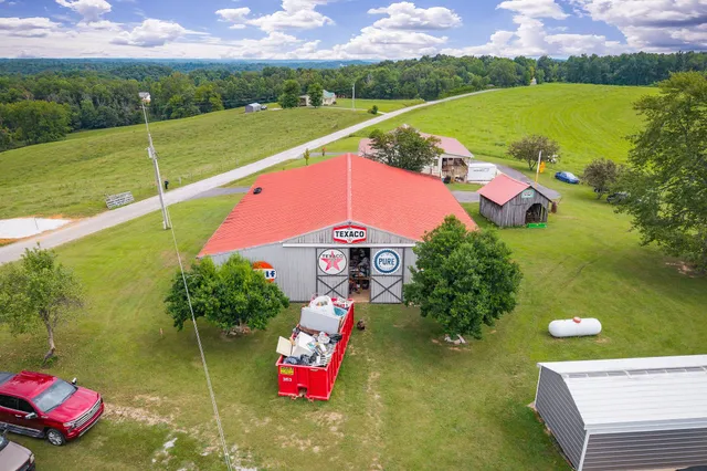 an aerial view of a residential houses with outdoor space swimming pool and ocean view