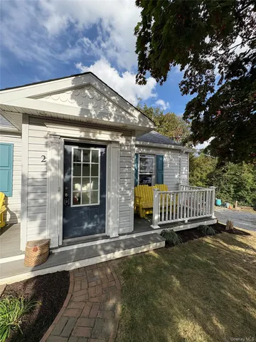 a view of a house with a wooden deck