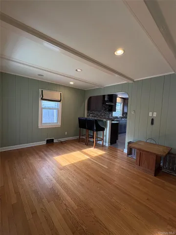 a view of a livingroom with furniture and wooden floor