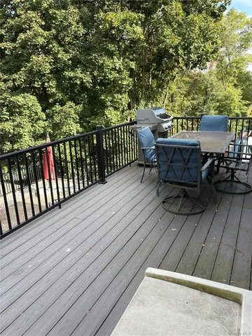 a view of a patio with wooden floor