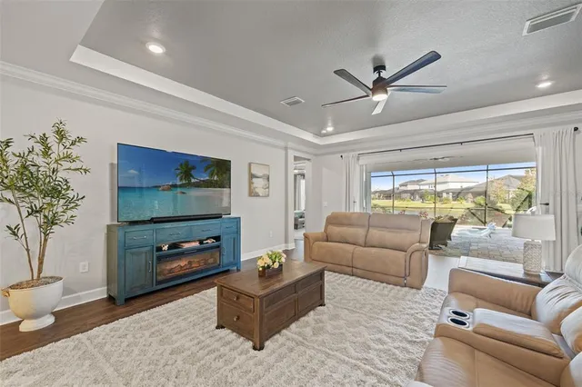 a spacious bedroom with a bed and a dresser in it