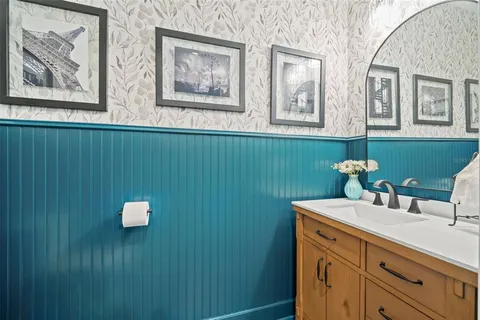 an aerial view of residential houses with outdoor space and river