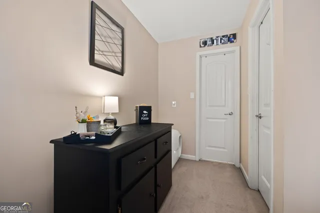 a view of a sink a mirror and cabinets