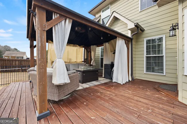 a view of living room with wooden floor and fence