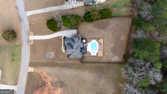 an aerial view of a house with outdoor space
