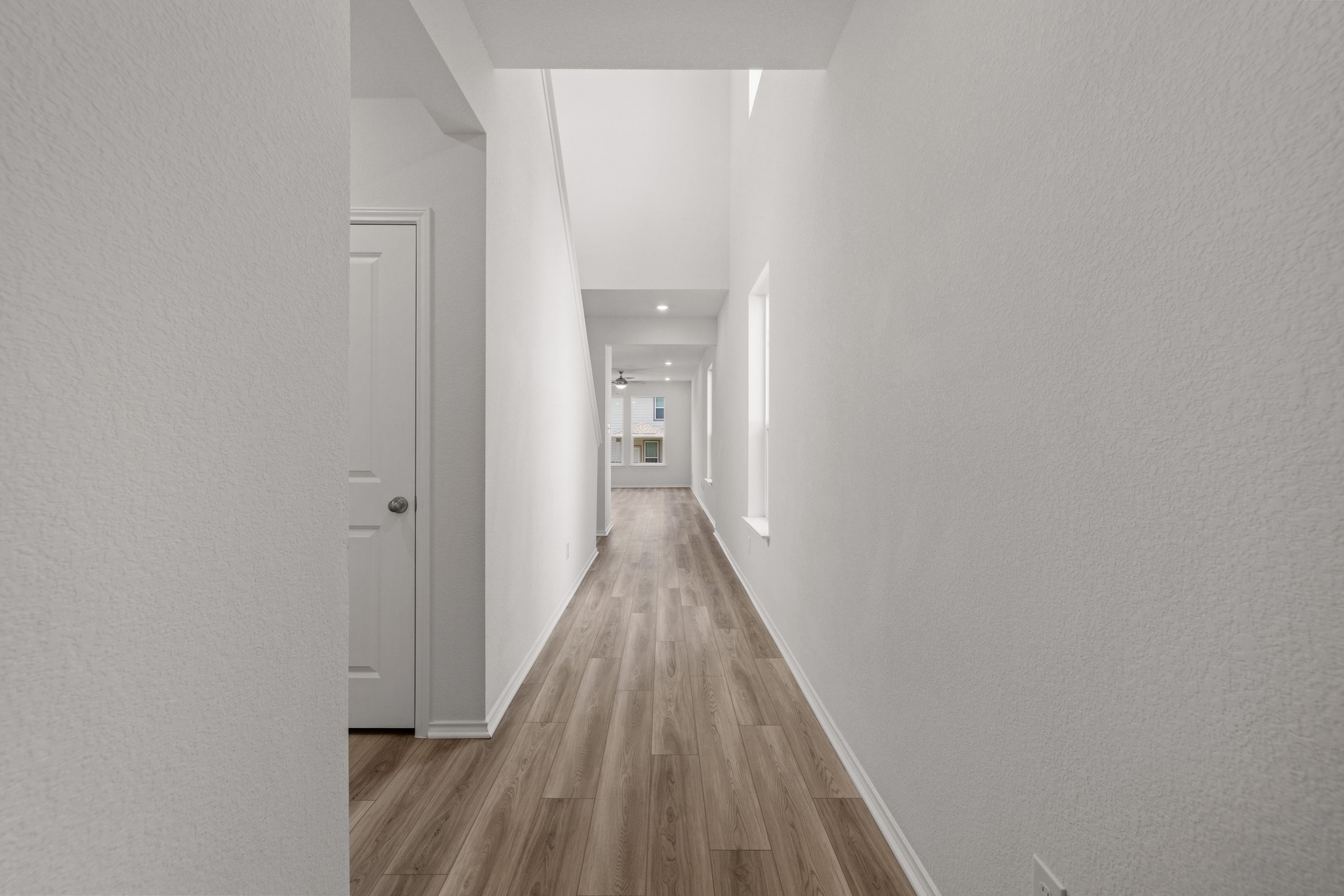 260 Feathers Street Jarrell, TX 76537 - Photo 5 of 34 a view of a hallway with wooden floor