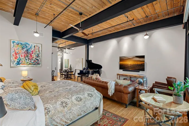 a view of walk in closet with clothes