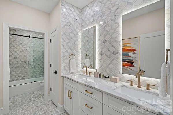 a bathroom with a shower and a bath tub