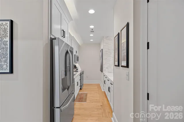 a bathroom with double vanity and mirrors