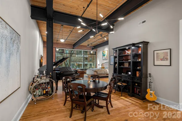 a view of a patio with table and chairs