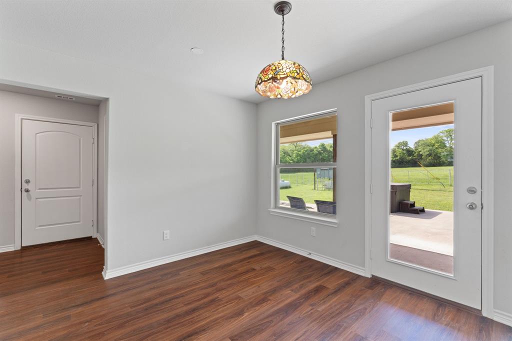 254 Jackson Road Whitewright, TX 75491 - Photo 31 of 40 Dining room with view of patio, jacuzzi, and pasture