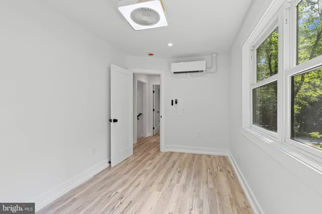 a bathroom with a bathtub with a shower