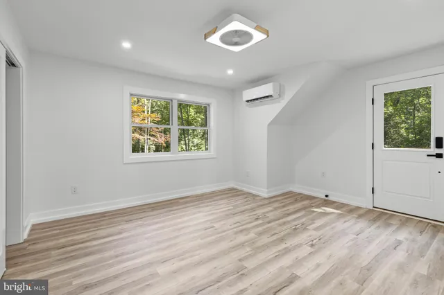 a bathroom with a sink and a window