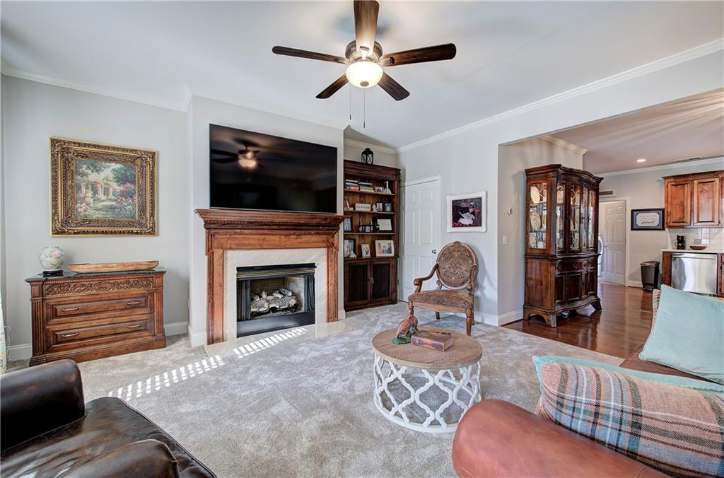 618 Manor Way Cartersville, GA 30120 - Photo 5 of 35 a living room with furniture a flat screen tv and a fireplace