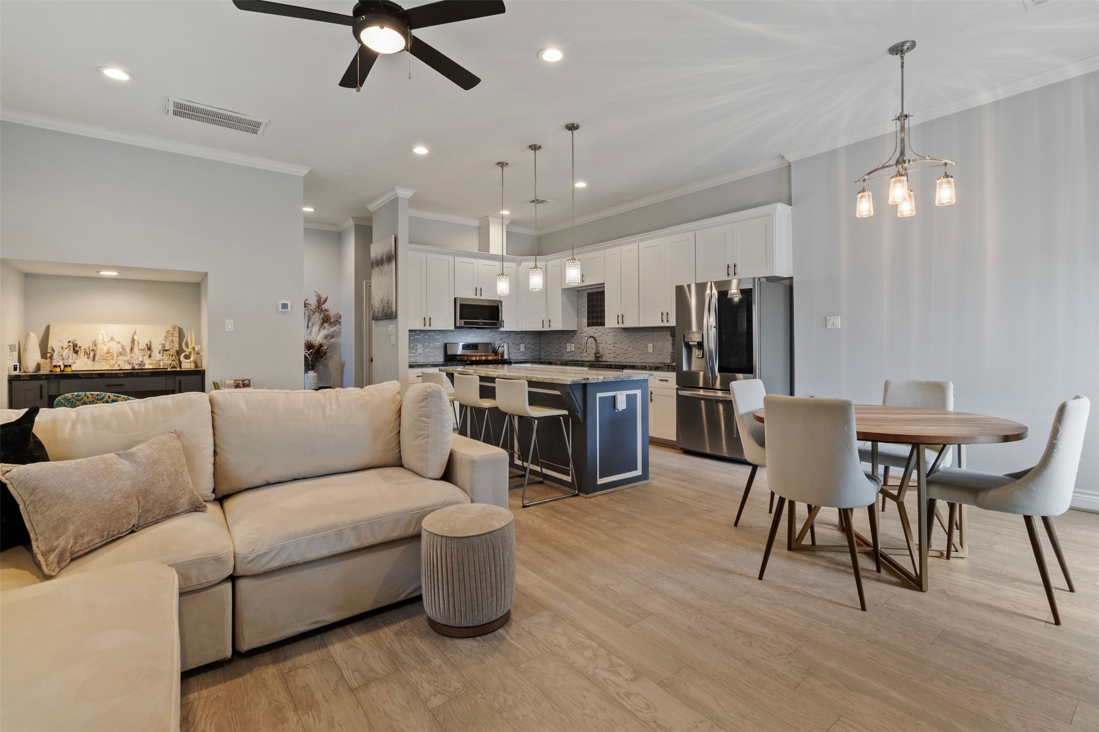 6706 Lozier Street Houston, TX 77021 - Photo 25 of 32 a living room with furniture kitchen view and a chandelier