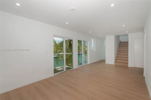 a view of an empty room with a sliding door