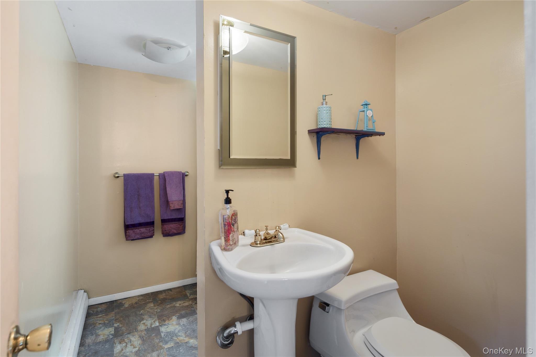36 Granite Springs Road Granite Springs, NY 10527 - Photo 40 of 49 a bathroom with a toilet sink and mirror