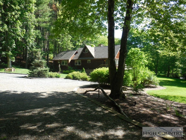 378 Howard's Creek Road Boone, NC 28607 - Photo 1 of 35 a view of a house with a yard