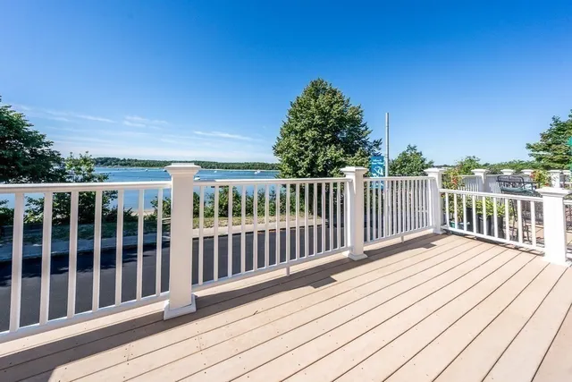 a view of deck with wooden floor and fence