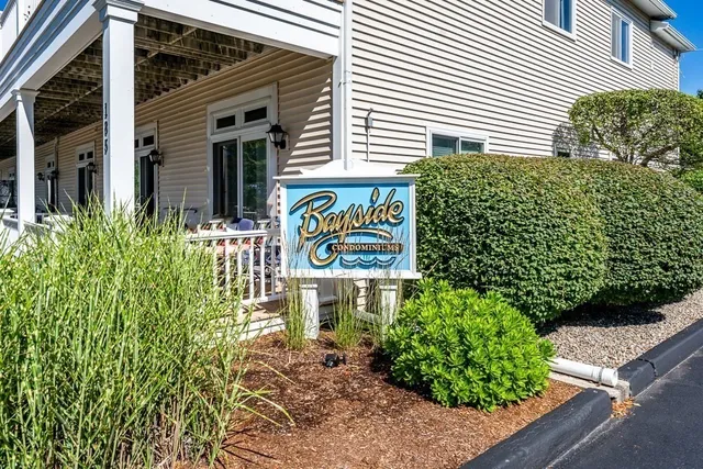 a sign that is on a brick wall