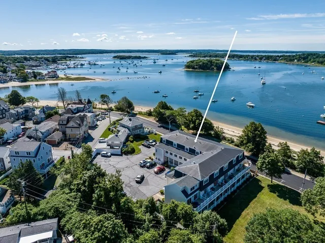 an aerial view of house with a yard
