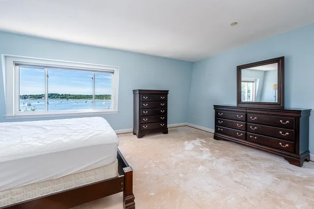 a bed room with a bed and a window