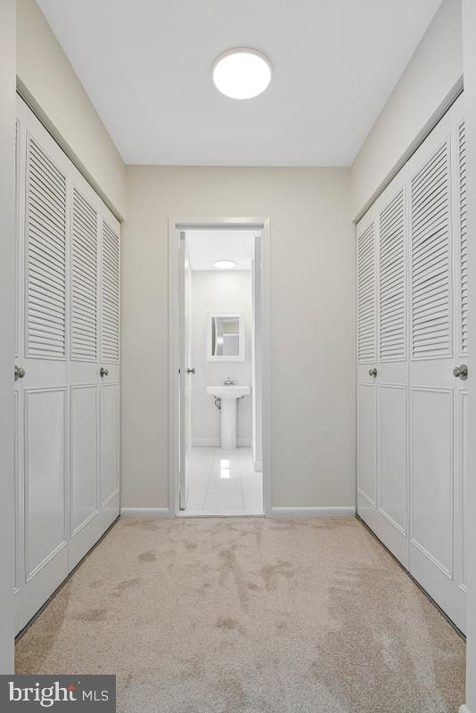 11814 Blue Spruce Road Reston, VA 20191 - Photo 26 of 56 Primary closets and 1st bathroom entrance