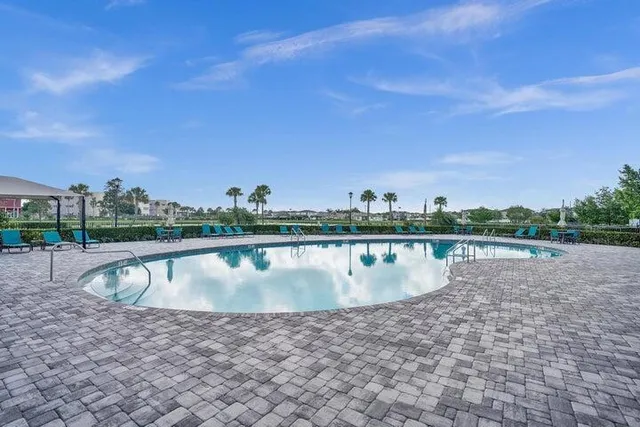 a view of a swimming pool with a lake view