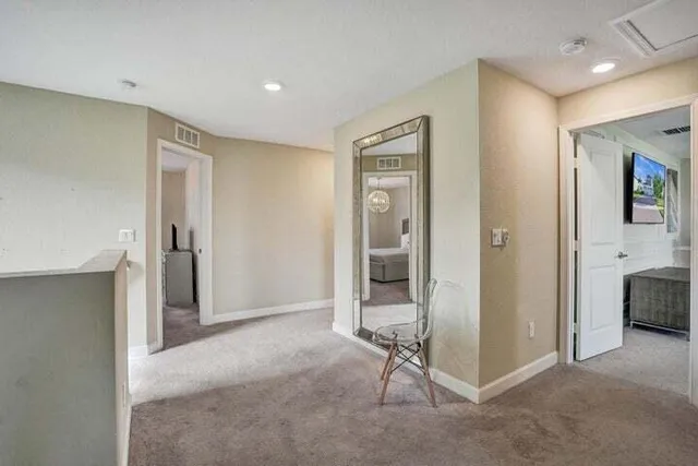 a view of a livingroom with a furniture and a ceiling fan