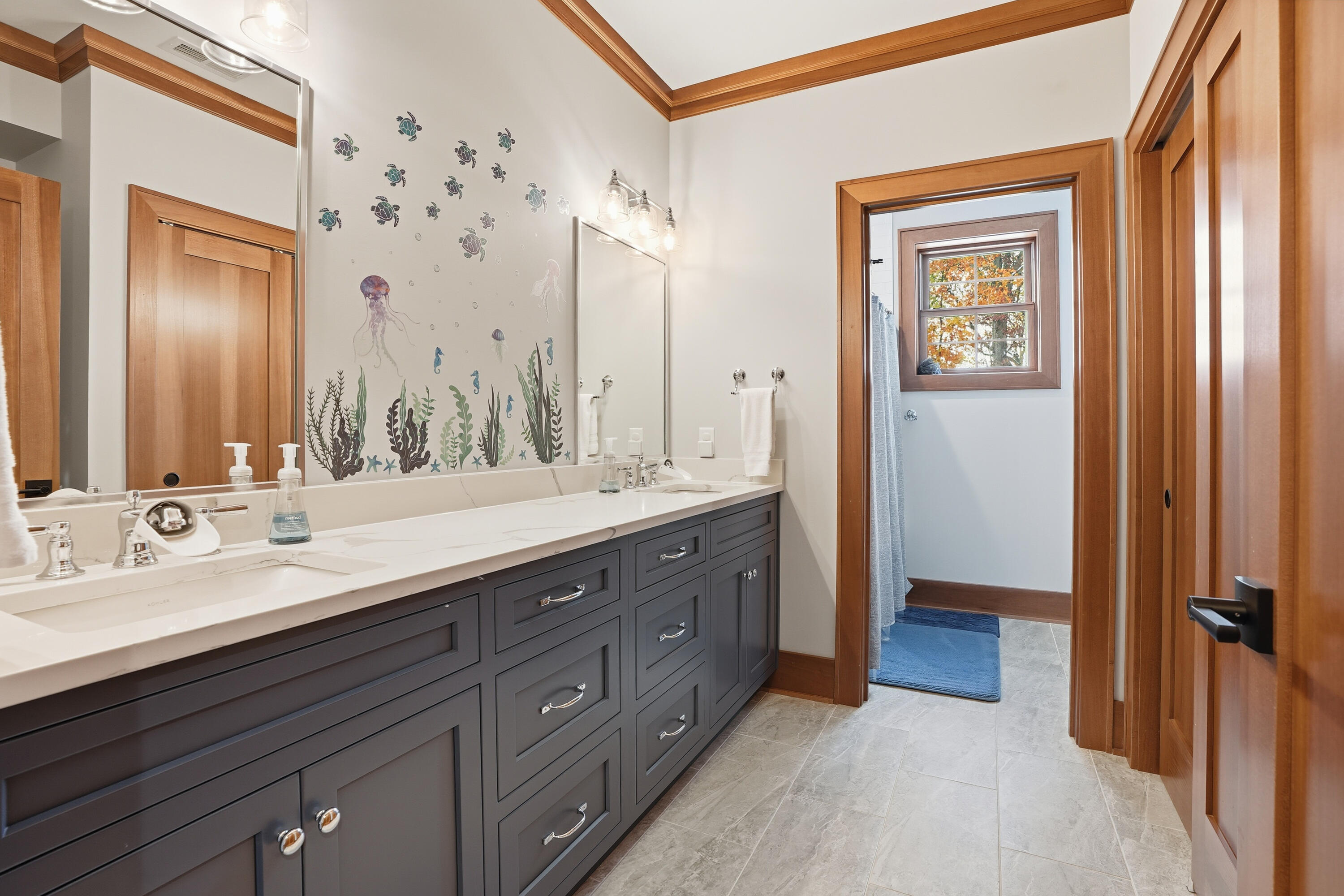 804 Shannon Drive Crown Point, IN 46307 - Photo 55 of 79 a bathroom with a double vanity sink and a mirror