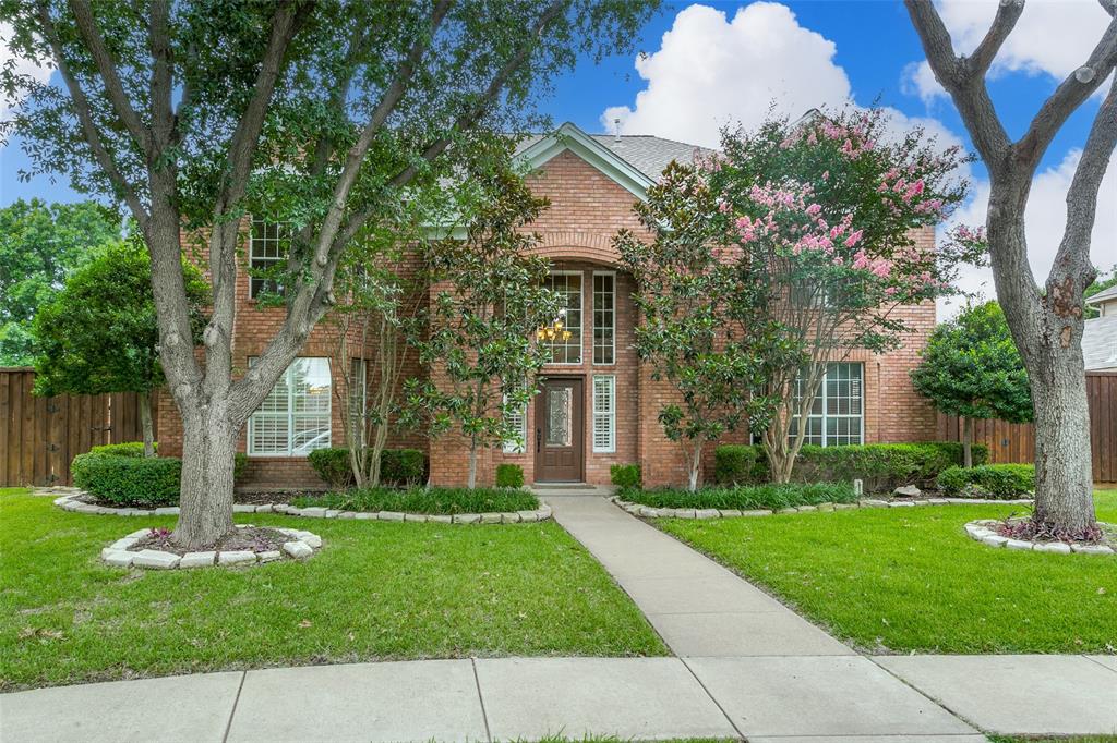 149 Windham Circle Coppell, TX 75019 - Photo 1 of 1 a front view of a house with garden