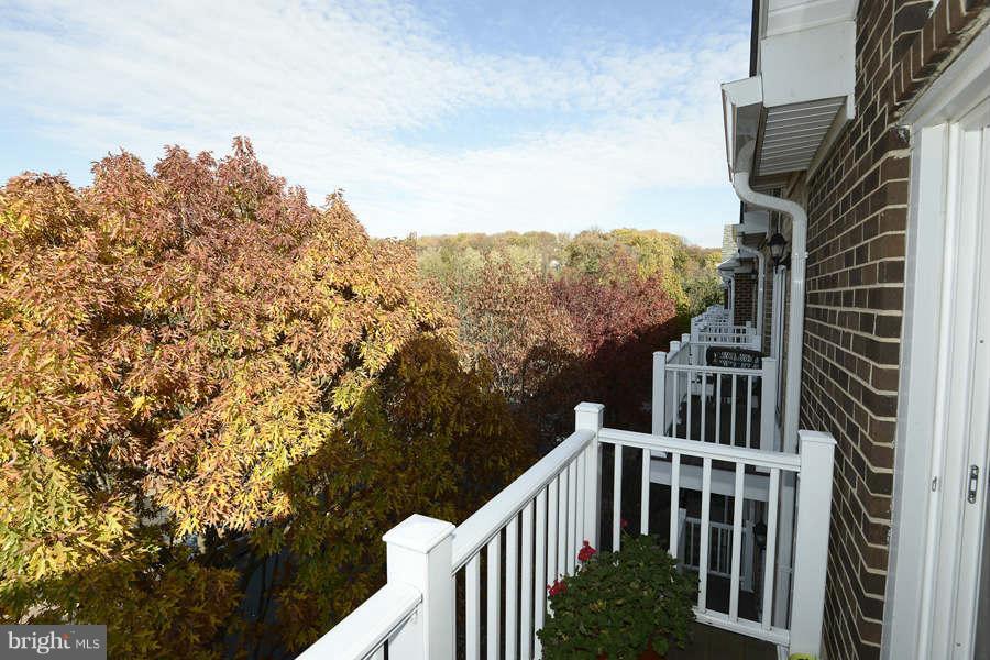 3052 South Glebe Road Arlington, VA 22206 - Photo 13 of 16 a view of balcony with wooden floor and fence