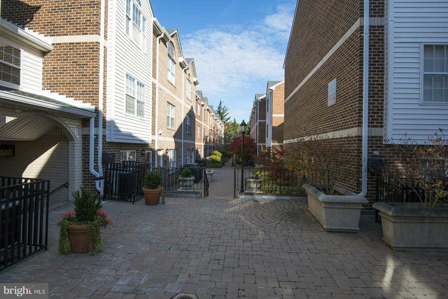 3052 South Glebe Road Arlington, VA 22206 - Photo 16 of 16 a view of a patio with couches and a fire pit and wooden fence