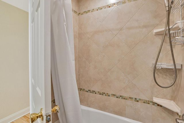 a bathroom with a bath tub and a shower