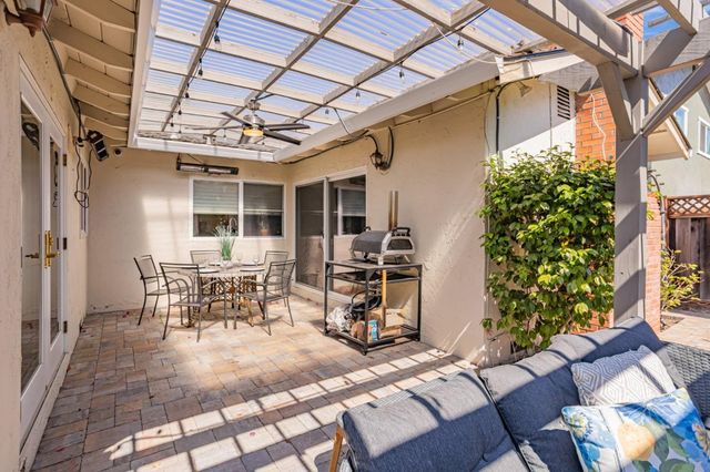 a view of a chairs and table in the patio
