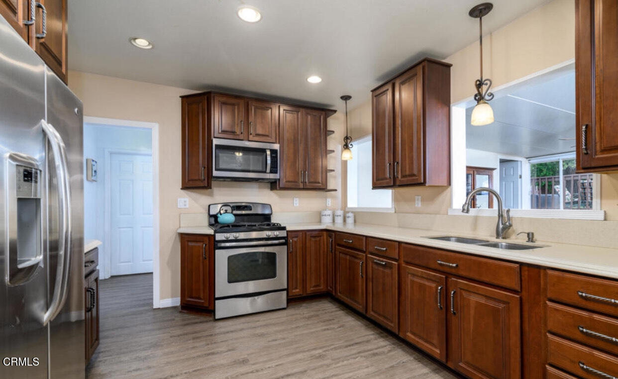 5152 North Street Somis, CA 93066 - Photo 2 of 2 a kitchen with stainless steel appliances granite countertop a sink a stove a refrigerator and a microwave