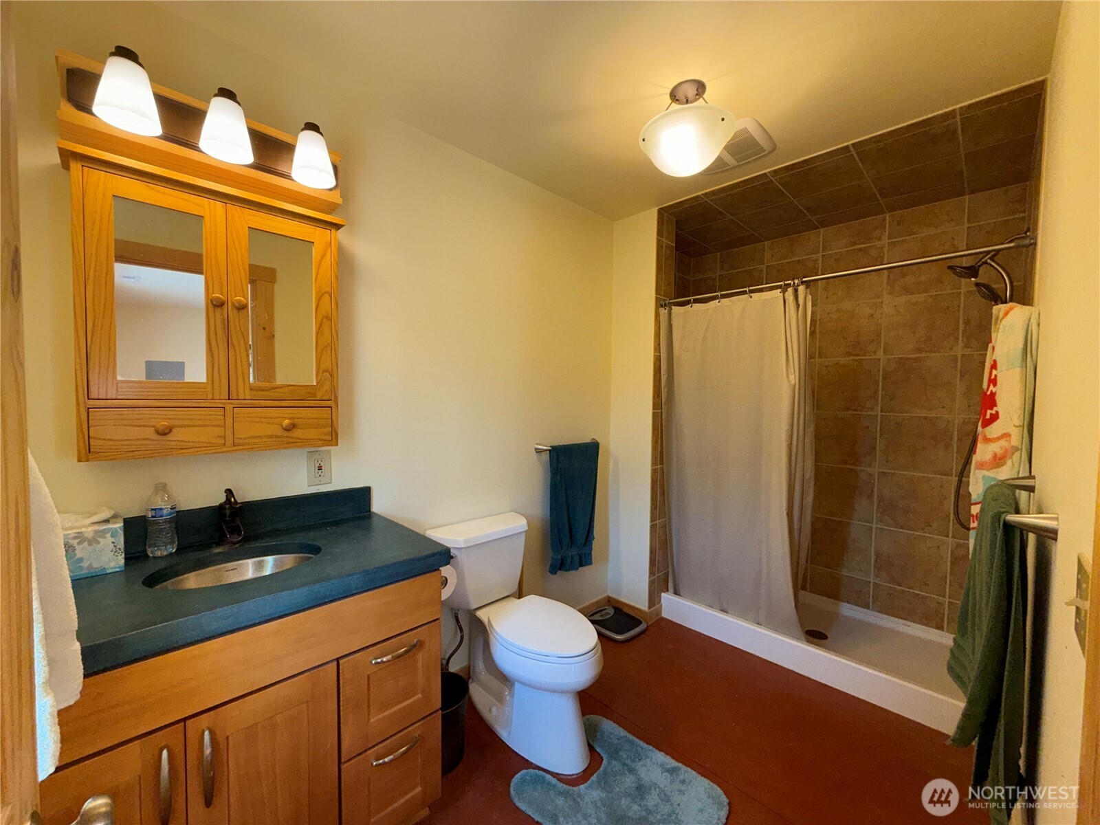 167 Excelsior Way Curlew, WA 99118 - Photo 11 of 37 a bathroom with a granite countertop sink a toilet and shower