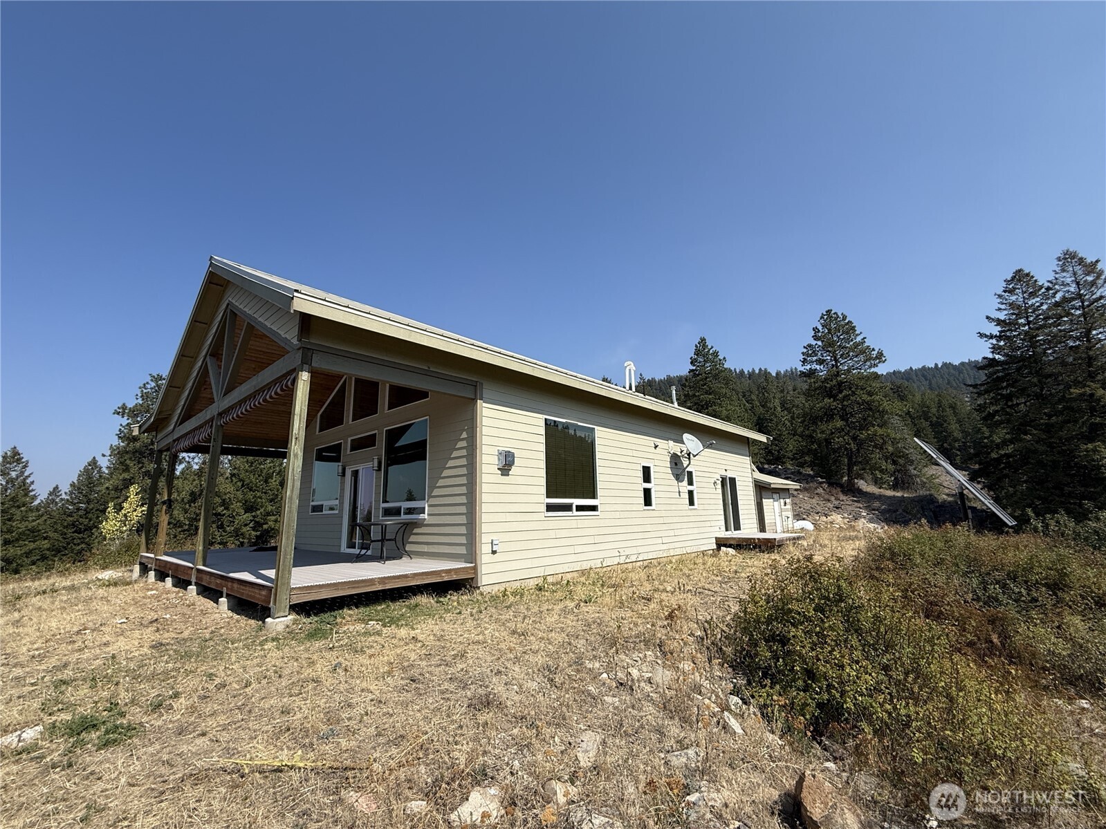 167 Excelsior Way Curlew, WA 99118 - Photo 18 of 37 a front view of a house with a yard